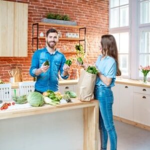 Couple with healthy food on the kitchen