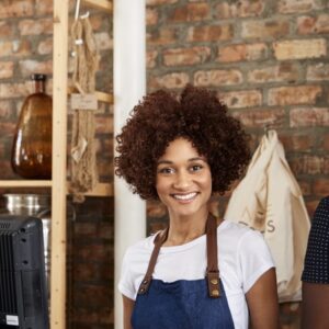 Portrait Of Male And Female Owners Of Sustainable Plastic Free Grocery Store